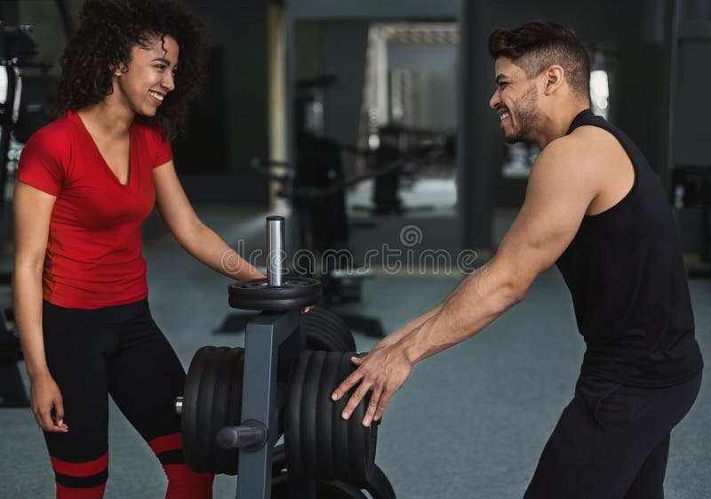 African-american athlete girl talking with trainer in gym stock photography African-american athlete girl talking with trainer in gym stock photography