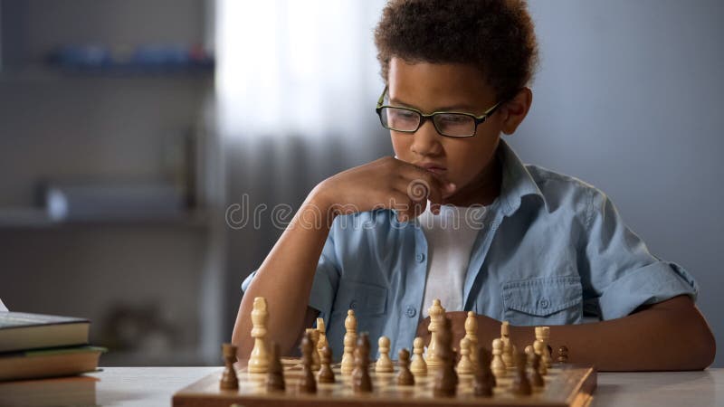African American Boy Logically Thinking Out Strategy of Playing Chess, Hobby  Stock Photo - Image of logically, board: 126247860