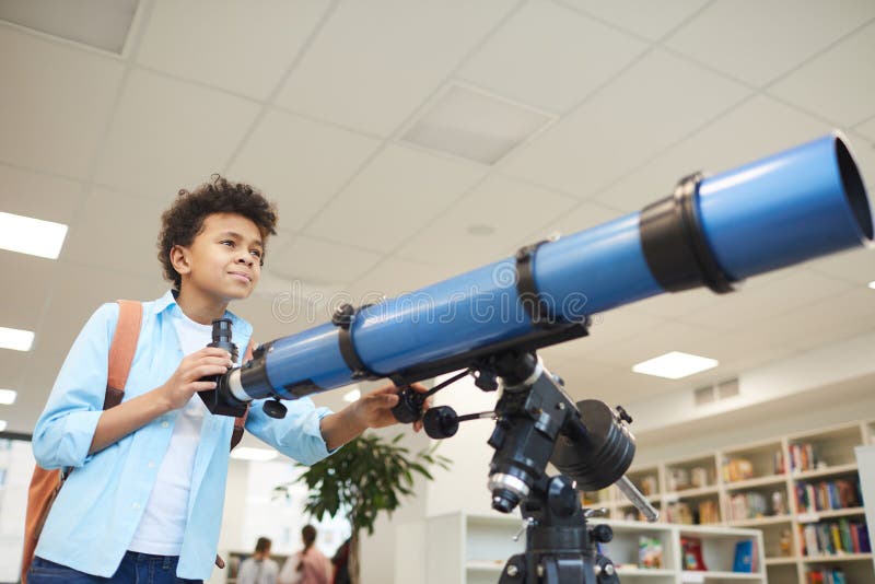 African American Boy With Telescope royalty free stock photos