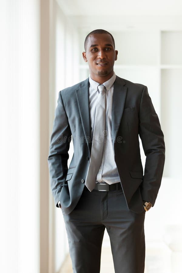 African American Business Man Using a Tactile Tablet Over White Stock ...