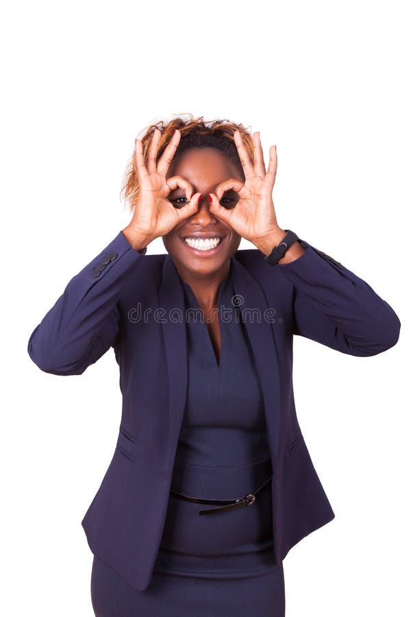 African American business woman making binocular gesture with he stock photography