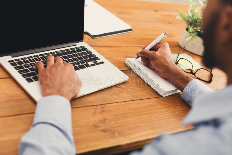 African-american businessman typing on laptop stock images African-american businessman typing on laptop stock images