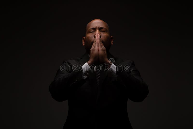 African American Christian Man Praying and Seeking Guidance from God