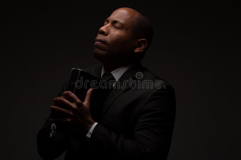 African American Christian Man Praying and Seeking Guidance from God