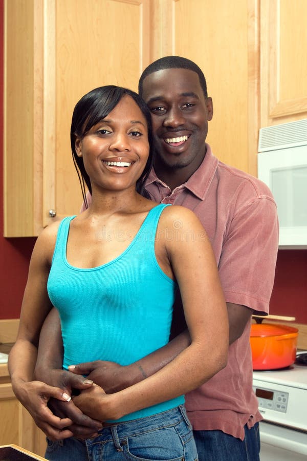 African American Couple in Kitchen - Vertical