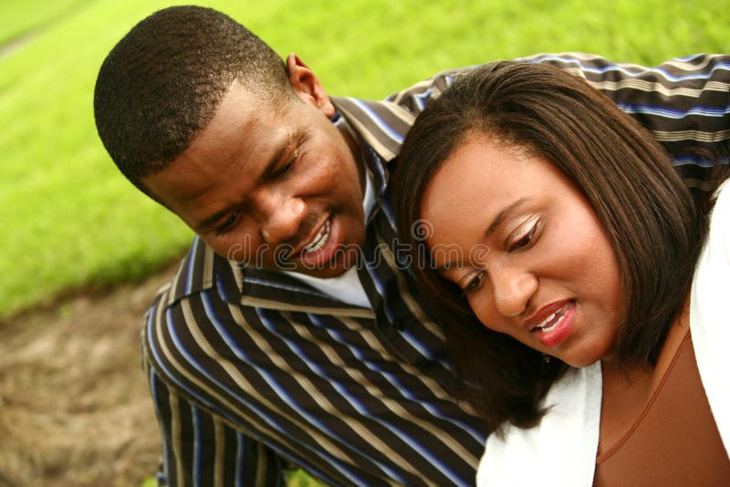 African American Couple Looking To The Bottom Outd