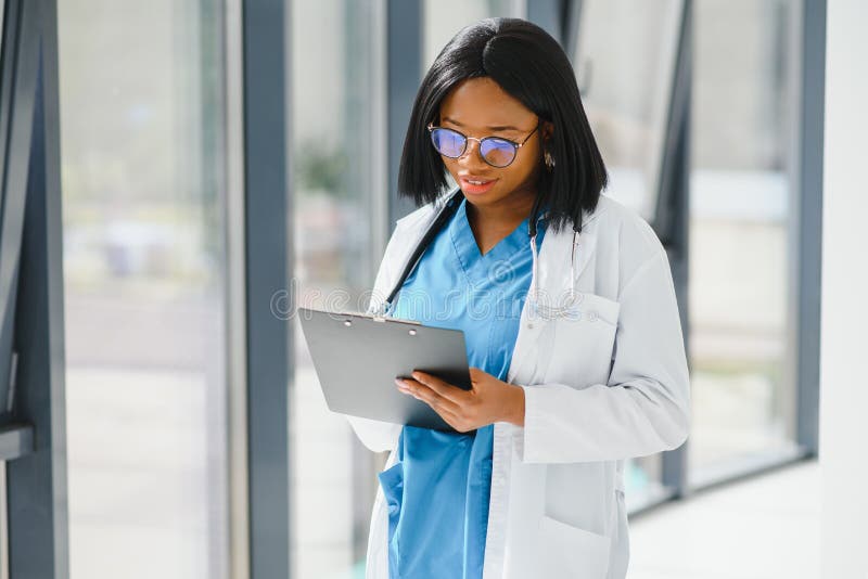 African American Doctor Working in Her Office at Clinic Stock Photo ...