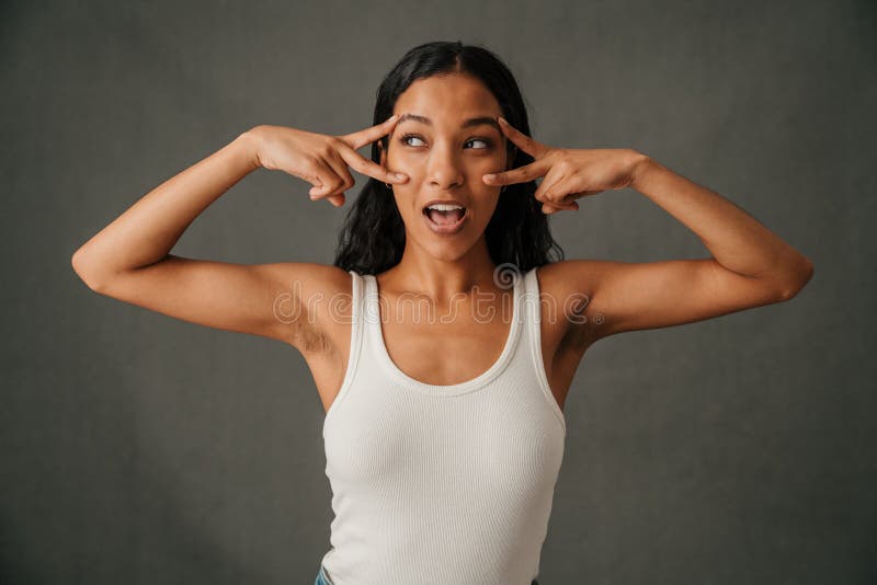 African American Female Showing Her Well Toned Arms and Making Peace Sign  Stock Photo - Image of ethnicity, fashionable: 251356178