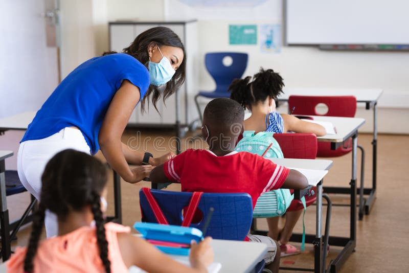 A Teacher and Students Wearing Face Masks · Free Stock Photo