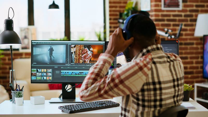 African american filmmaker man works on a professional video shoot royalty free stock photo