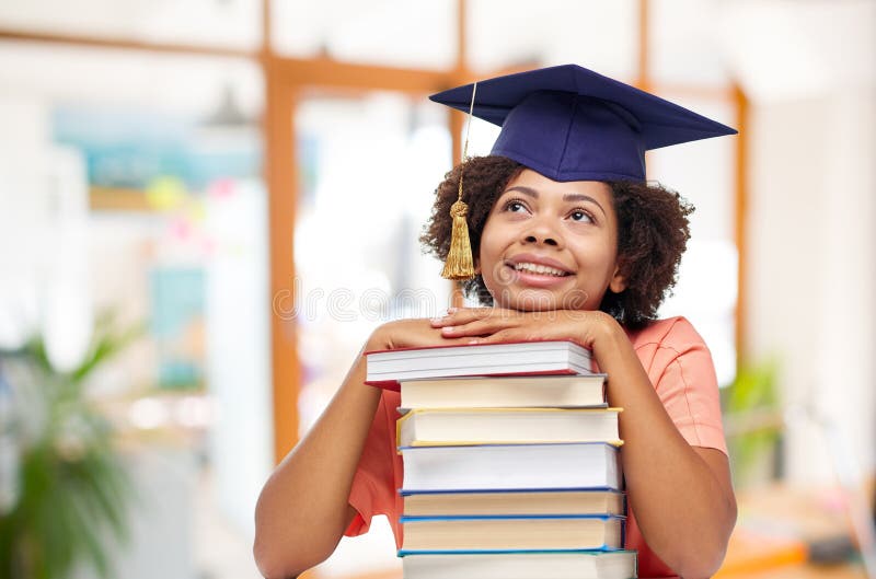 African american graduate student with books stock image African american graduate student with books stock image
