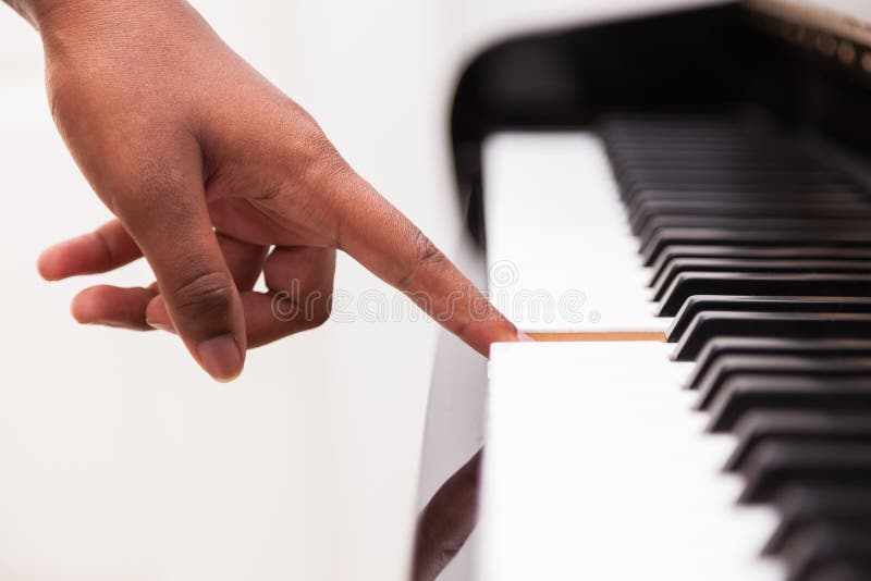 African American Hand Playing Piano Stock Photo - Image of harmony