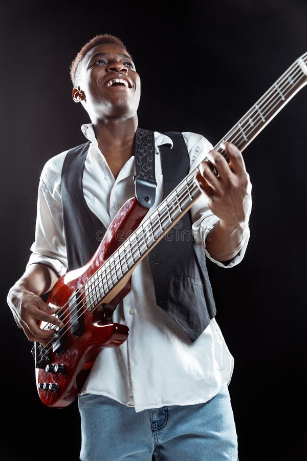 African American Jazz Musician Playing Bass Guitar. Stock Image