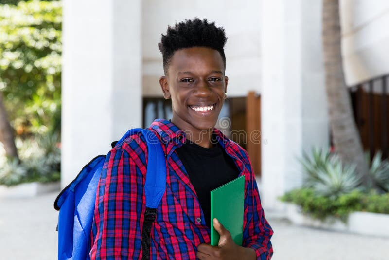 African american male student with book