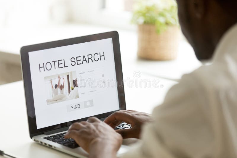 African-american man browsing hotel online using search app on l