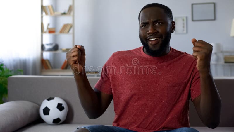 African-american man dancing victoriously, celebrating victory of football team royalty free stock image African-american man dancing victoriously, celebrating victory of football team royalty free stock image