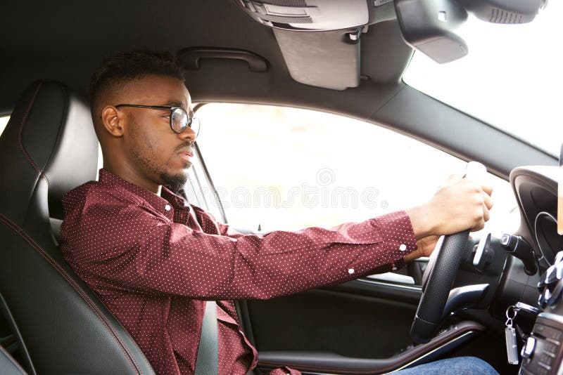 African american man driving car royalty free stock images
