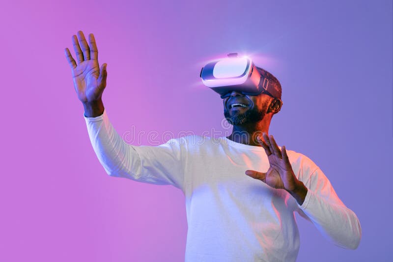 African American Man Experiencing Virtual Reality, Using VR Goggles ...
