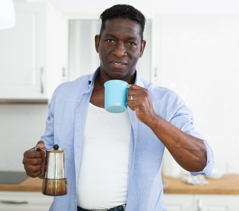 Man serving coffee from a moka pot Stock Photo by ©nito103 117806646