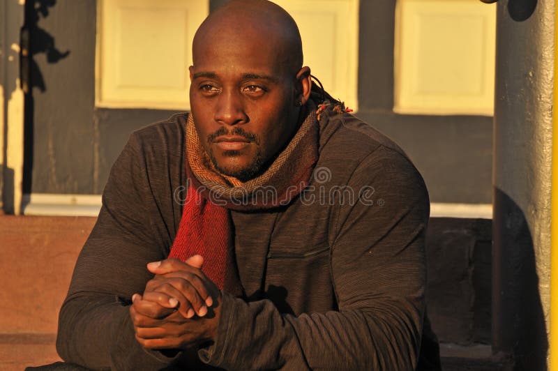 African American Man Warming Up on Cold Evening stock image African American Man Warming Up on Cold Evening stock image