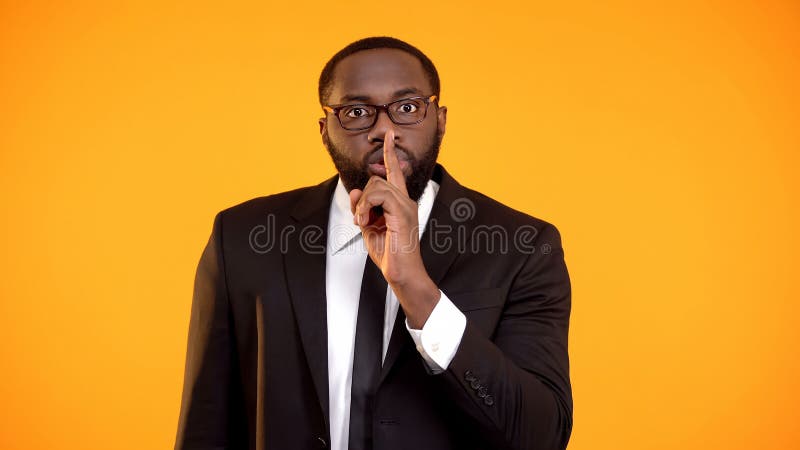 African-american manager showing quiet sign, gossips, personal data disclosure stock photo African-american manager showing quiet sign, gossips, personal data disclosure stock photo