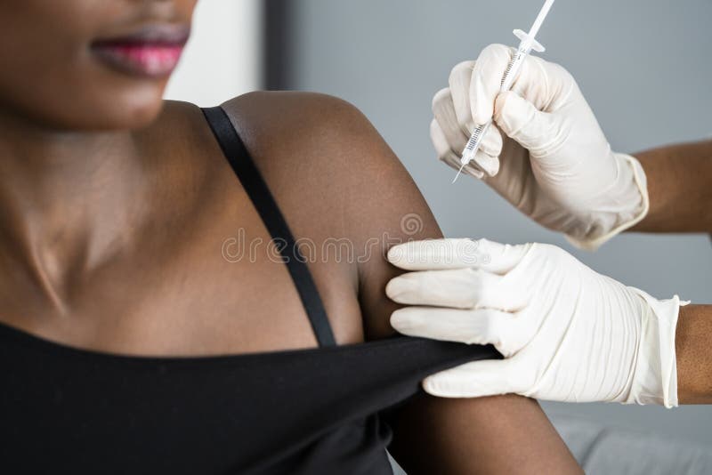 African American Nurse Making Covid-19 Vaccine Injection royalty free stock images