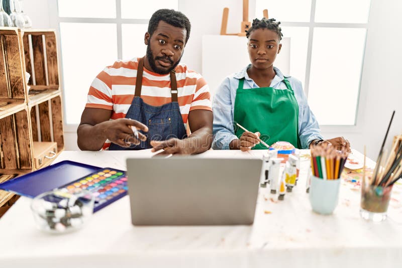 African American Painter Couple Having Online Paint Class Sitting on