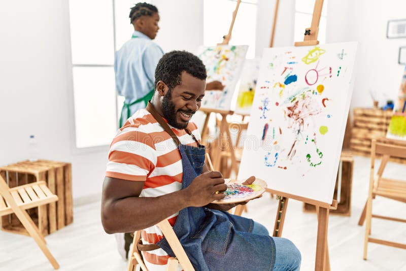 African american painter couple smiling happy painting at art studio royalty free stock photo