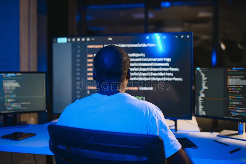 African american IT Programmer Working on Desktop Computer. stock photos