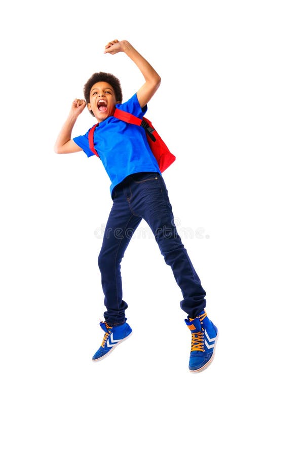 African American school boy jumping happy