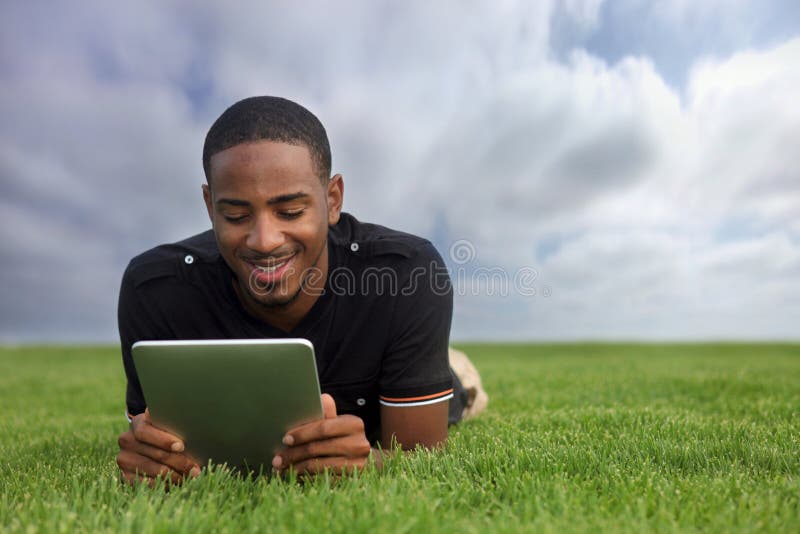 African American Student Reading Outdoors stock images African American Student Reading Outdoors stock images