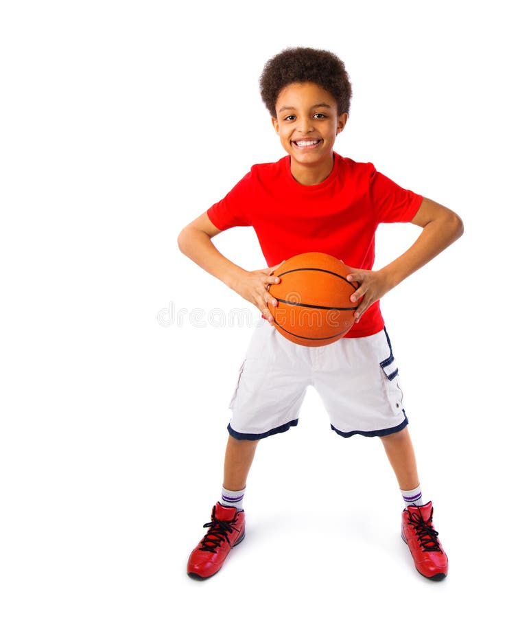 African american teenager playing basketball