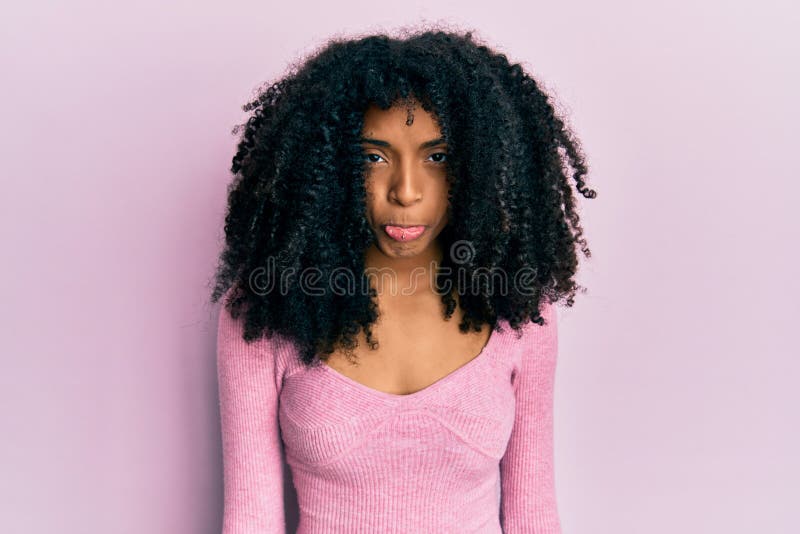 African American Woman with Afro Hair Wearing Casual Pink Shirt Depressed  and Worry for Distress, Crying Angry and Afraid Stock Photo - Image of  crying, face: 230597960