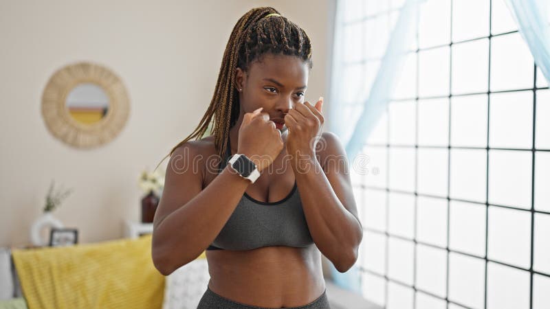 African american woman boxing at home stock images