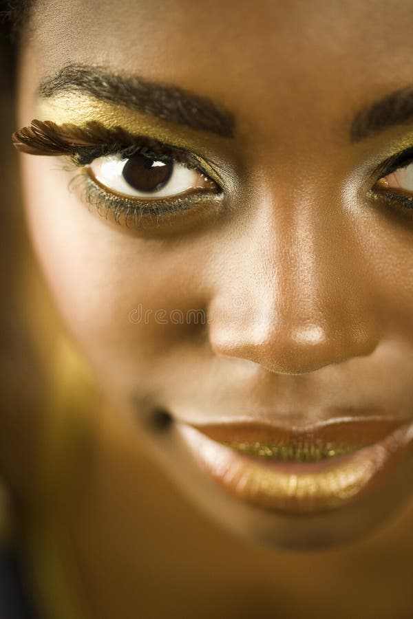 African American Woman With Golden Makeup