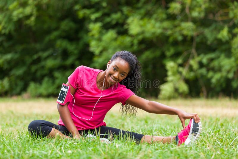 African american woman jogger stretching - Fitness, people and