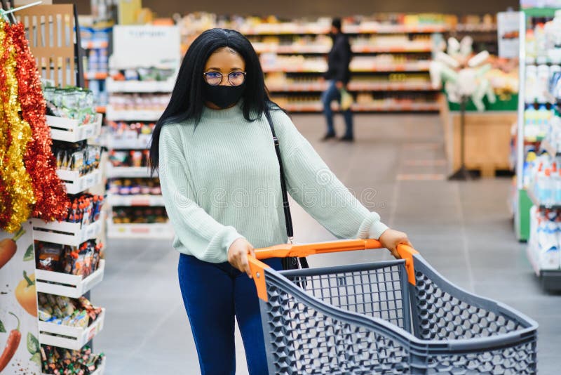 African American Woman with Shopping Cart Trolley in the Supermarket ...