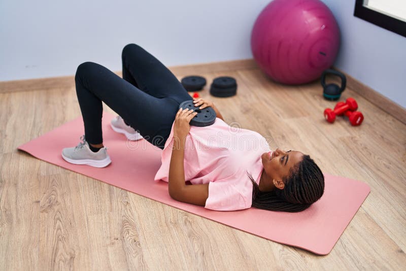 African American Woman Smiling Confident Training Abs Exercise at Sport ...