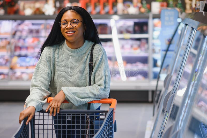 African American Woman at Supermarket with Shopping Cart Stock Photo ...