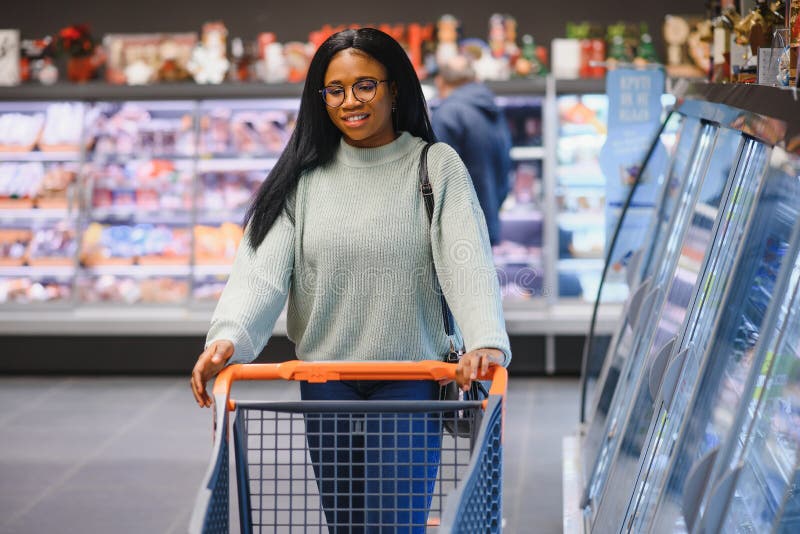 African American Woman at Supermarket with Shopping Cart Stock Photo ...