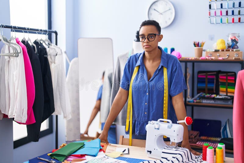 African American Woman Tailor Standing with Serious Expression at ...