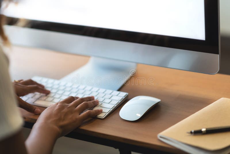 African American Woman working on Computer. Happy creative female Designer is doing graphic design at the office studio