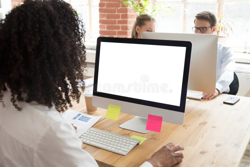 African American worker using computer at workplace royalty free stock photography