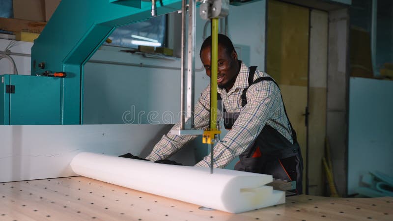 African American Workers Cut Sofa Foam Roll in Workshop stock video footage