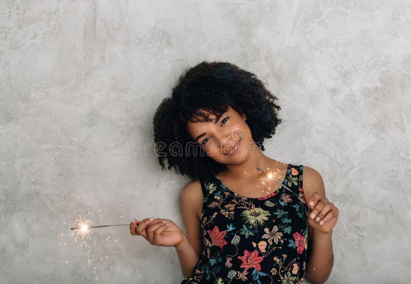 African American young woman with sparklers stock images African American young woman with sparklers stock images