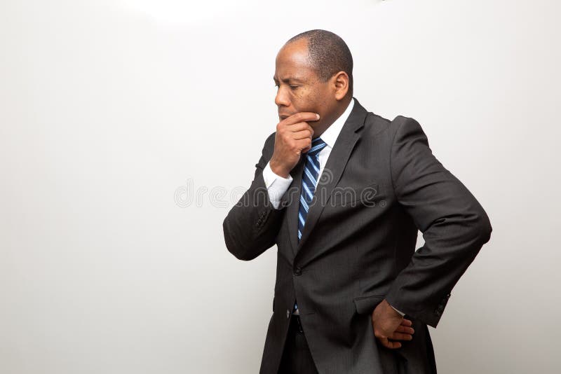 African Business Man Dressed in Suit Thinking