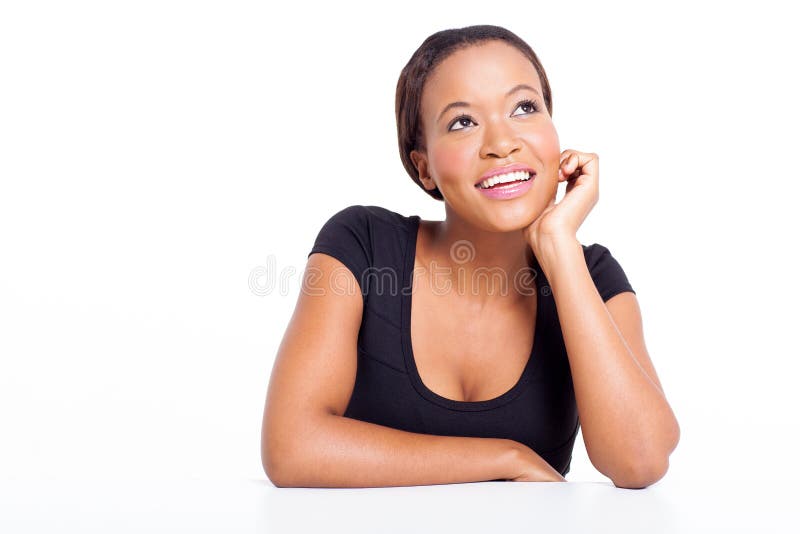 African businesswoman daydreaming