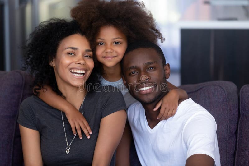 Loving young caucasian couple sitting together at home spending