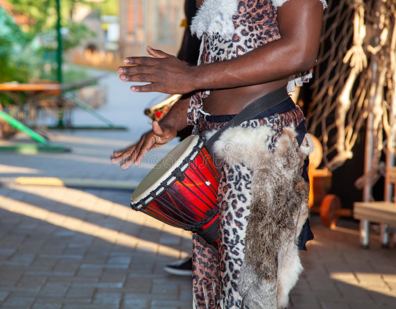 An African Drummer Plays the Djembe. Stock Photo Image of male