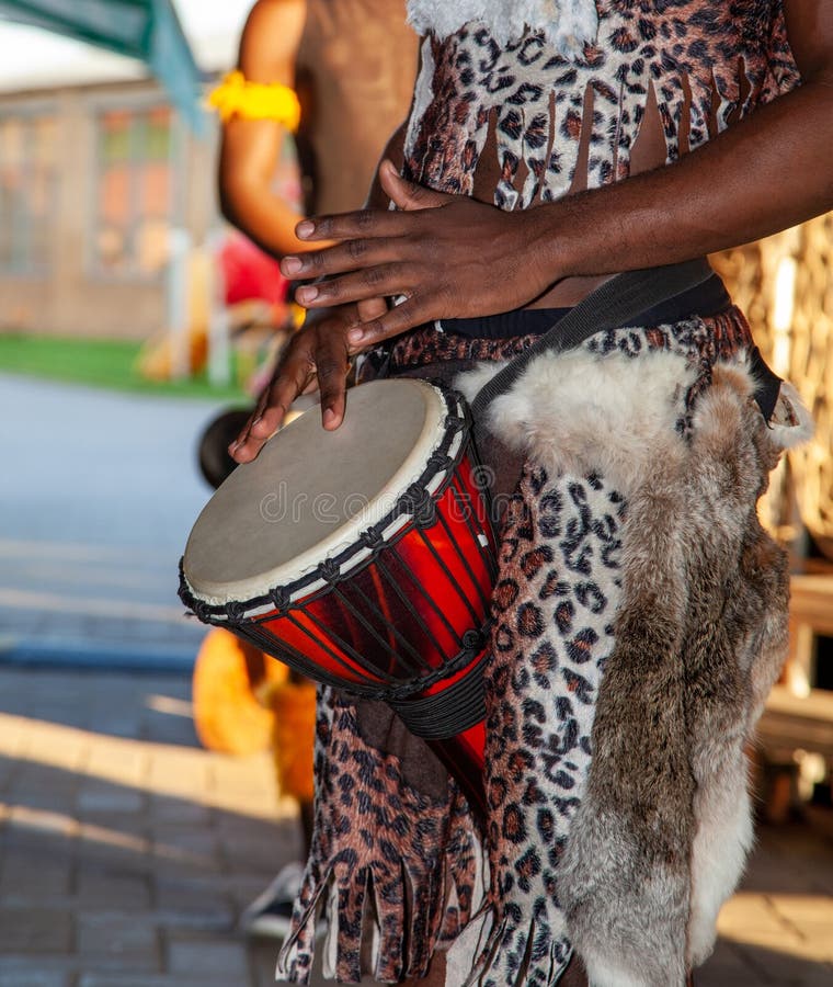 An African Drummer Plays the Djembe. Stock Image Image of closeup